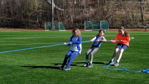 Children doing tug of war (ropes).