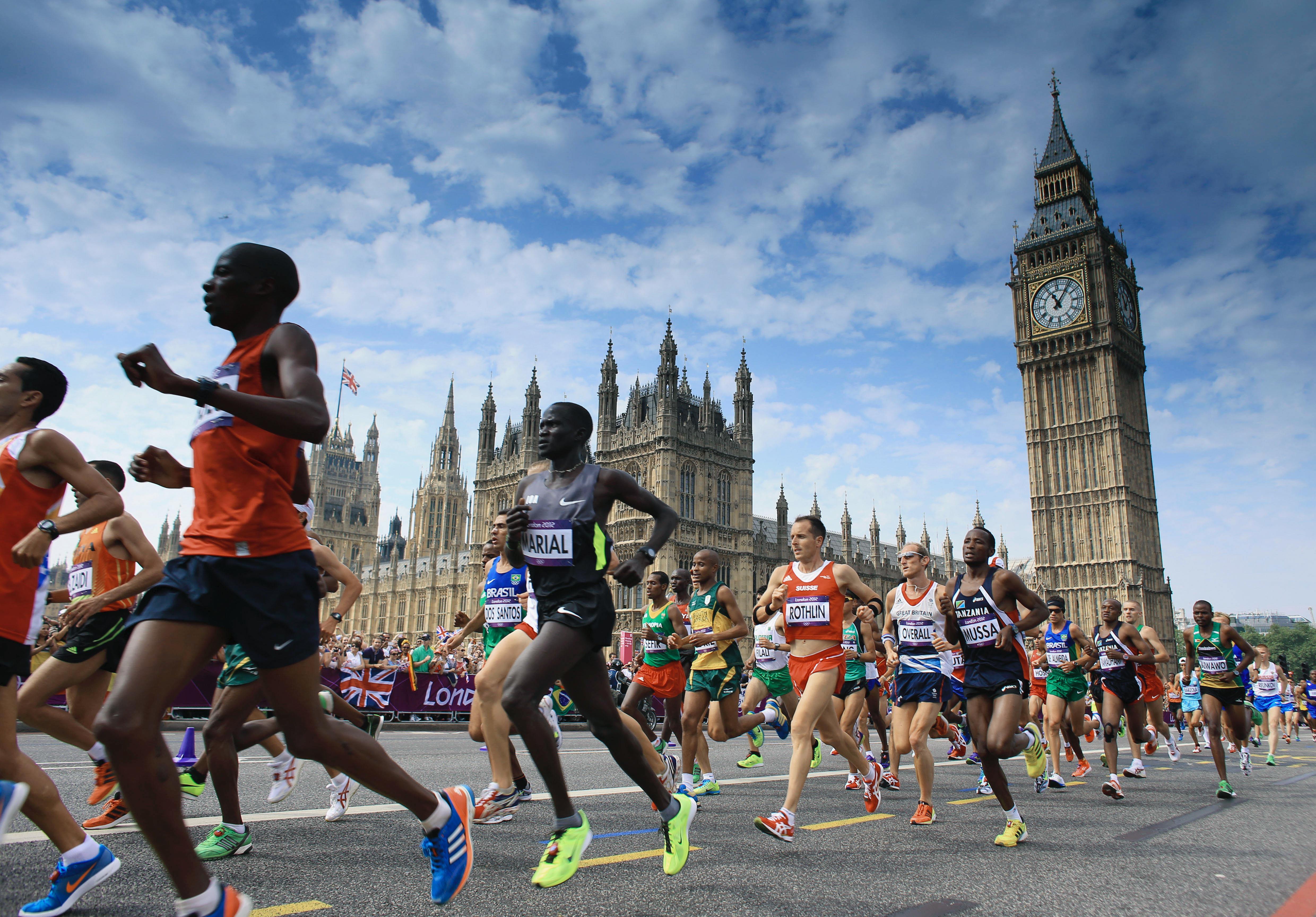 Several marathonrunners in an Olympic race in London 2012, Big Ben in the background.