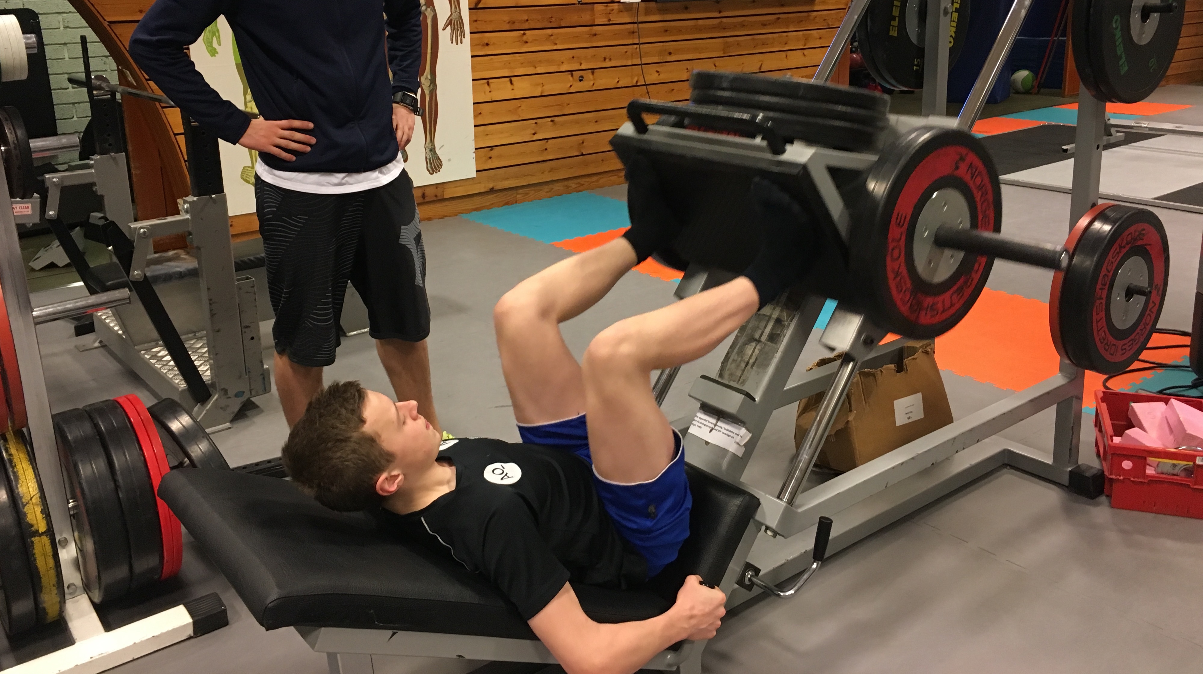 Athlete doing bench press in the gym.