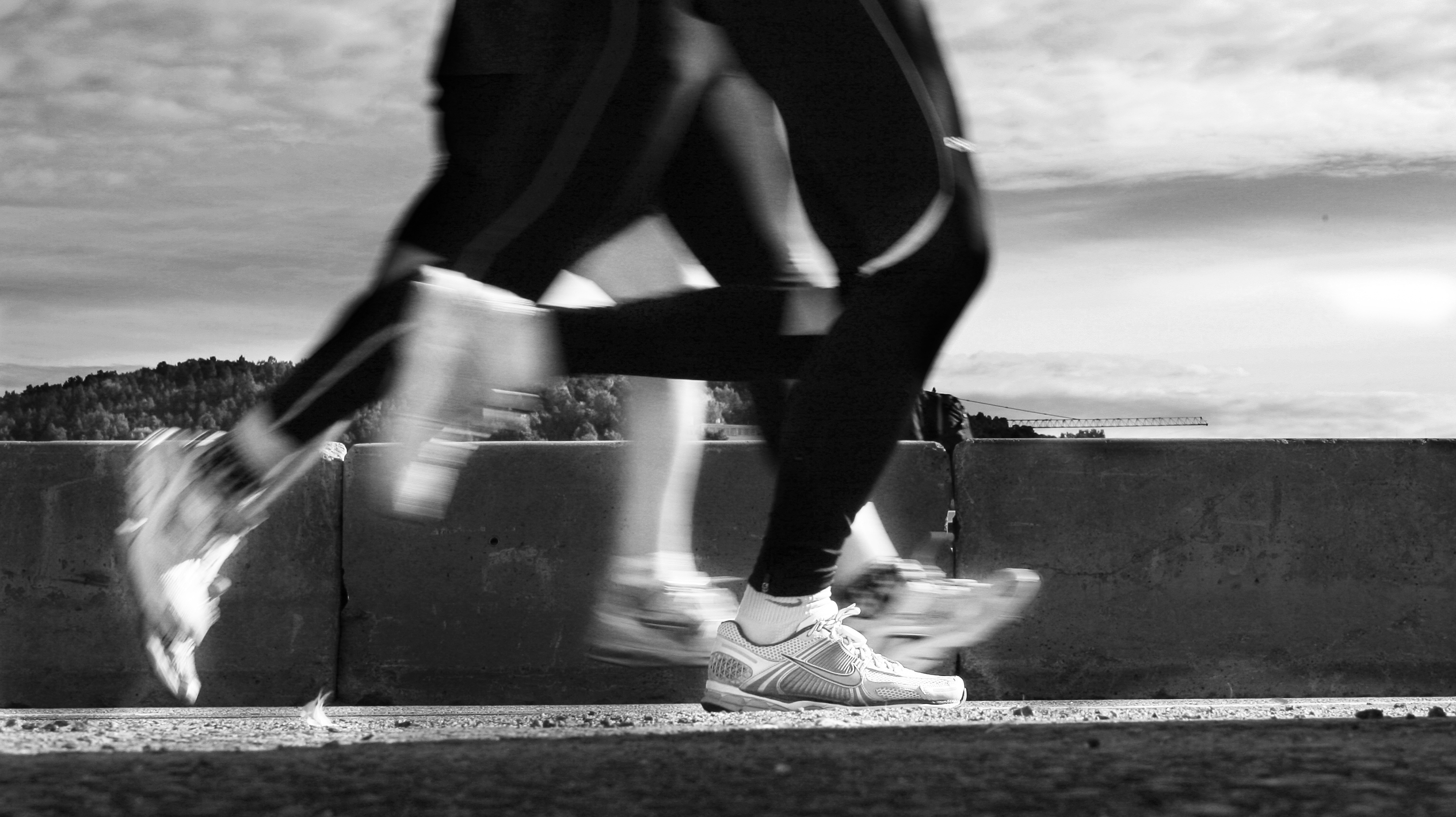 Black and white photo of someone running.