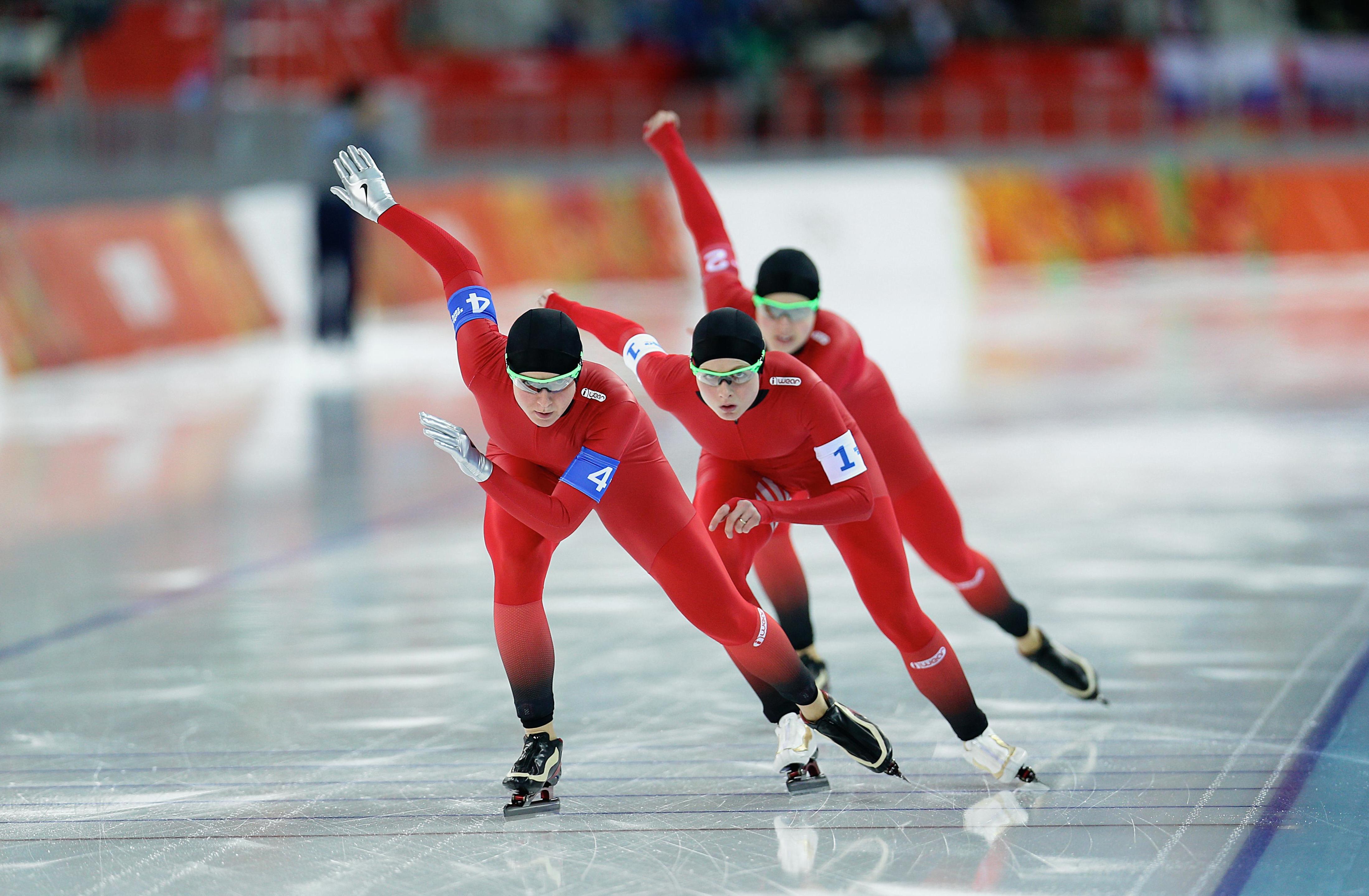 Three athletes on the same team in a row, in a team-competition.