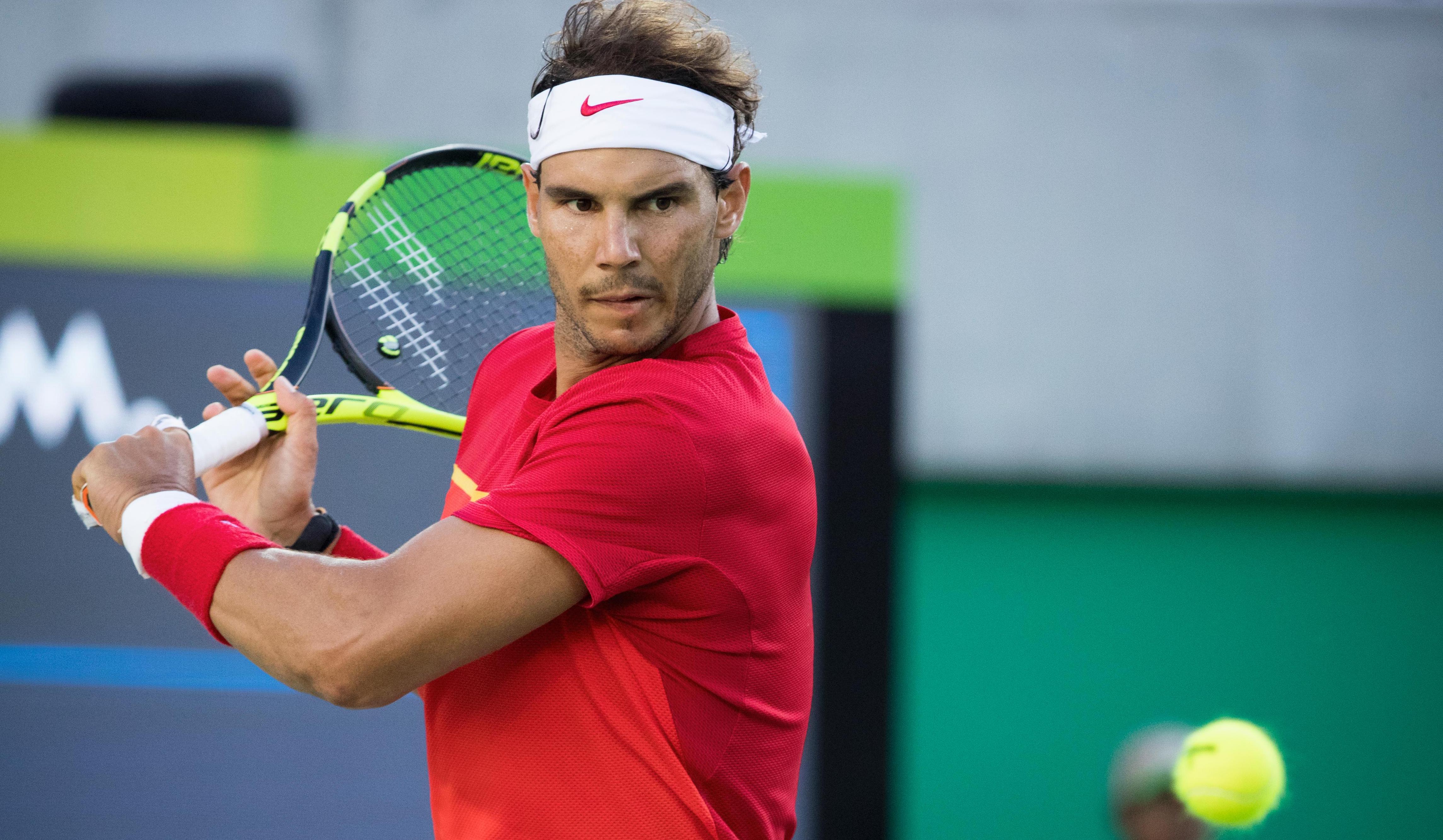 Athlete focusing on the ball approaching, getting ready to hit it with his racket.