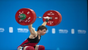 Weightlifter in a competiton lifting weights.